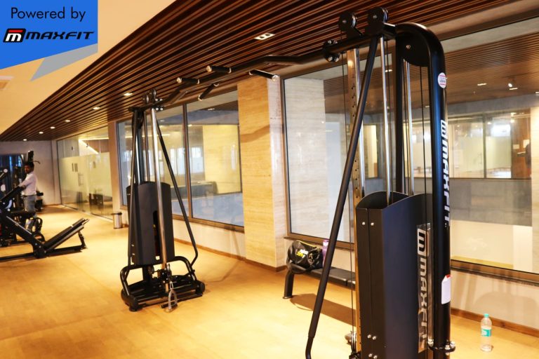 Ananda Bay Hills clubhouse featuring Maxfit commercial gym equipment, indoor games and outdoor play area by Maxfit Equipment Solutions in Narsingi, Hyderabad.