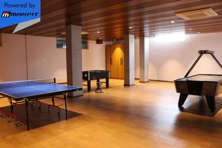 Ananda Bay Hills clubhouse featuring Maxfit commercial gym equipment, indoor games and outdoor play area by Maxfit Equipment Solutions in Narsingi, Hyderabad.