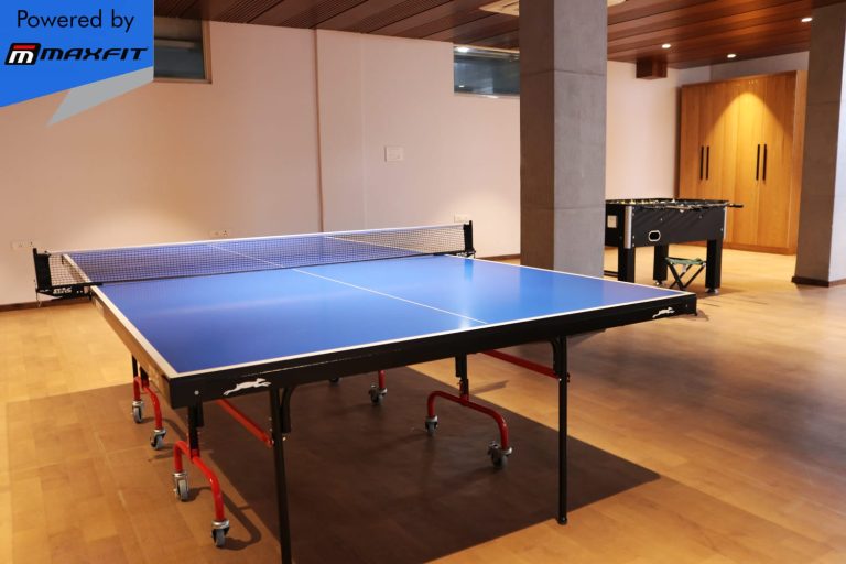 Ananda Bay Hills clubhouse featuring Maxfit commercial gym equipment, indoor games and outdoor play area by Maxfit Equipment Solutions in Narsingi, Hyderabad.