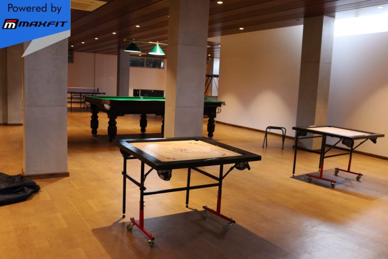 Ananda Bay Hills clubhouse featuring Maxfit commercial gym equipment, indoor games and outdoor play area by Maxfit Equipment Solutions in Narsingi, Hyderabad.