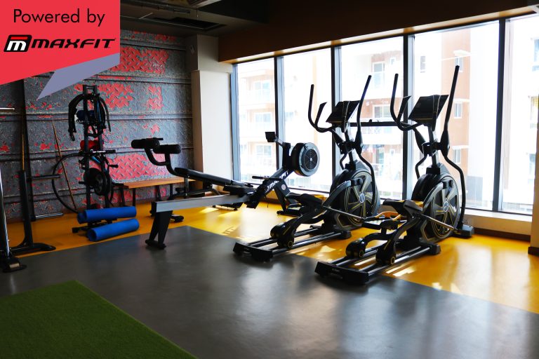 Sumadhura Acropolis premium clubhouse gym in Nanakramguda, Hyderabad, featuring Maxfit commercial fitness equipment by Maxfit Equipment Solutions.