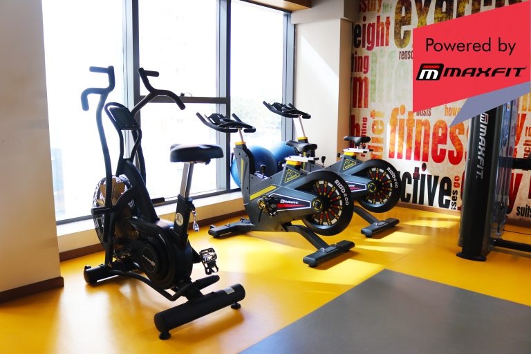 Sumadhura Acropolis premium clubhouse gym in Nanakramguda, Hyderabad, featuring Maxfit commercial fitness equipment by Maxfit Equipment Solutions.