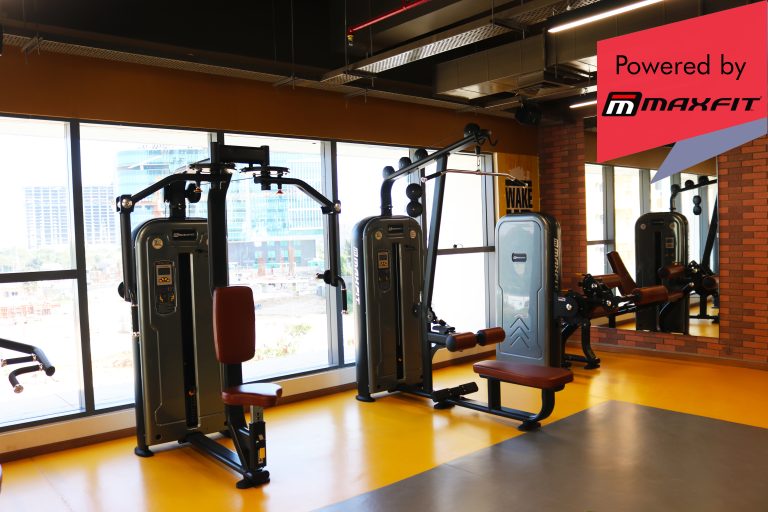 Sumadhura Acropolis premium clubhouse gym in Nanakramguda, Hyderabad, featuring Maxfit commercial fitness equipment by Maxfit Equipment Solutions.