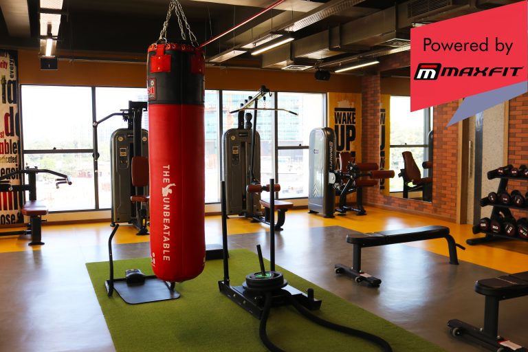 Sumadhura Acropolis premium clubhouse gym in Nanakramguda, Hyderabad, featuring Maxfit commercial fitness equipment by Maxfit Equipment Solutions.