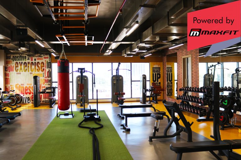 Sumadhura Acropolis premium clubhouse gym in Nanakramguda, Hyderabad, featuring Maxfit commercial fitness equipment by Maxfit Equipment Solutions.