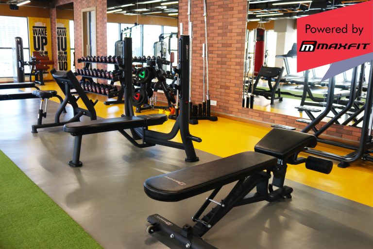 Sumadhura Acropolis premium clubhouse gym in Nanakramguda, Hyderabad, featuring Maxfit commercial fitness equipment by Maxfit Equipment Solutions.